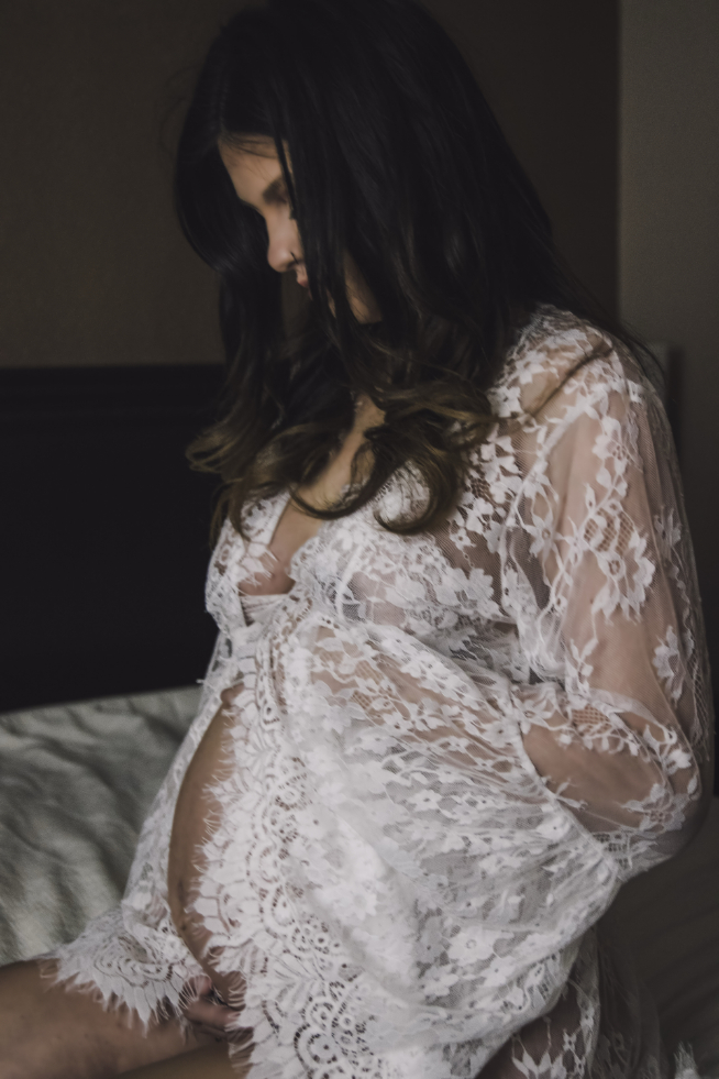 Pregnant woman in white lingerie.